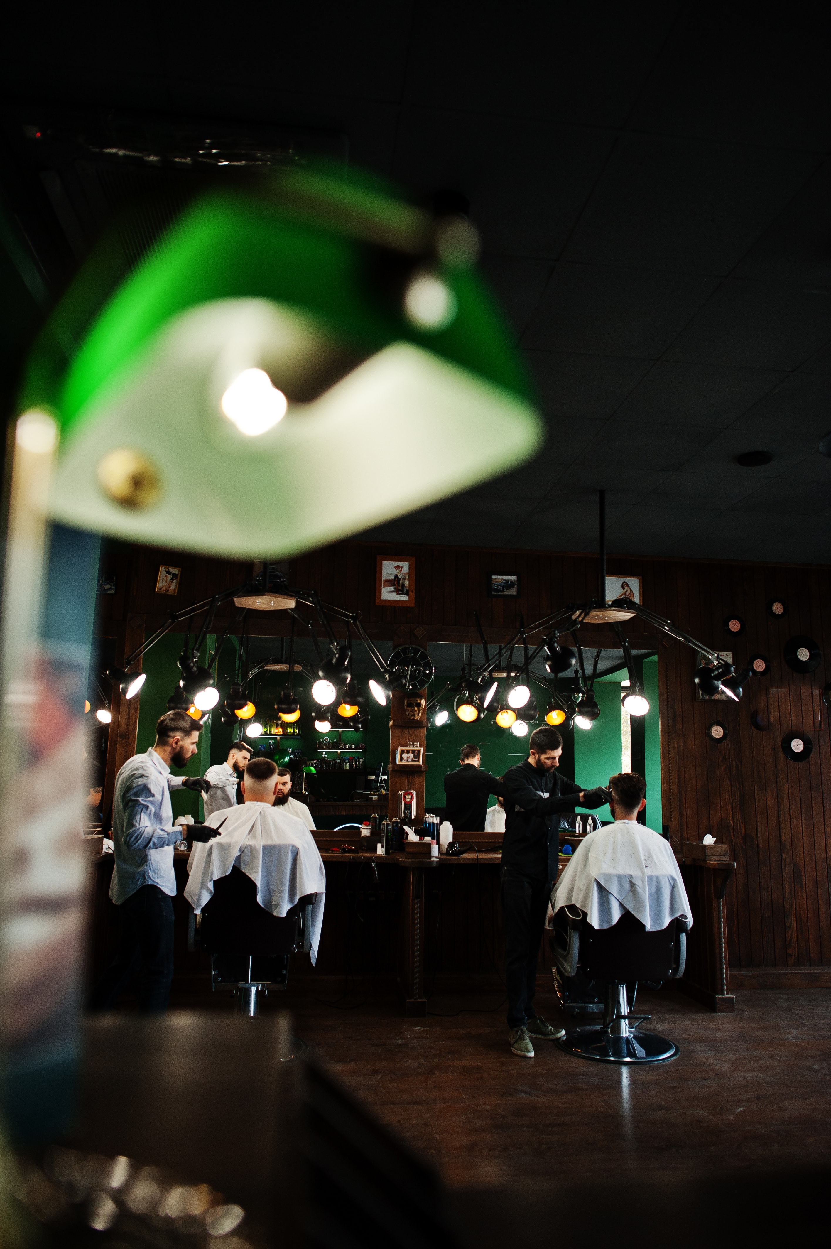 Men at work in a barbershop for the Epre Barbershop project